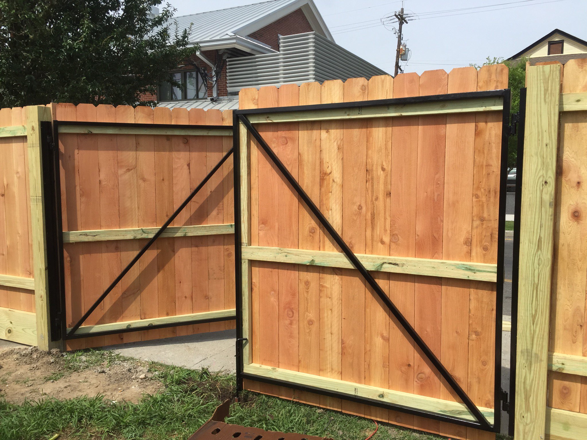 Wood privacy fence and metal framed gate